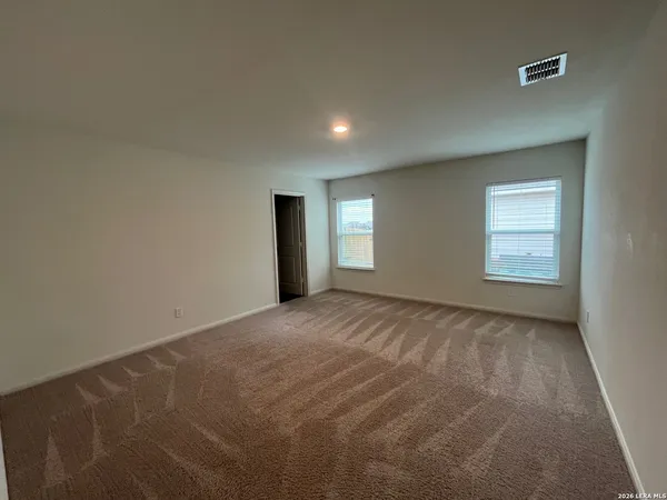 a view of empty room with windows
