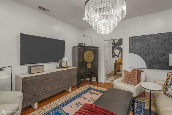 a living room with furniture and a flat screen tv