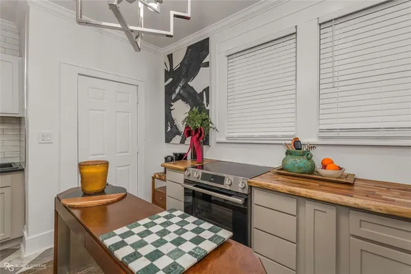 a kitchen with a sink cabinets and stove top oven