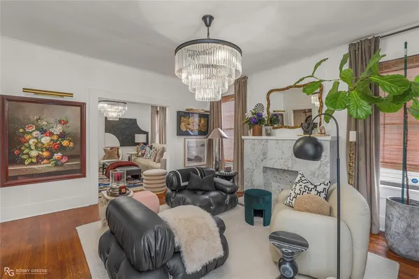 a bedroom with furniture and a chandelier