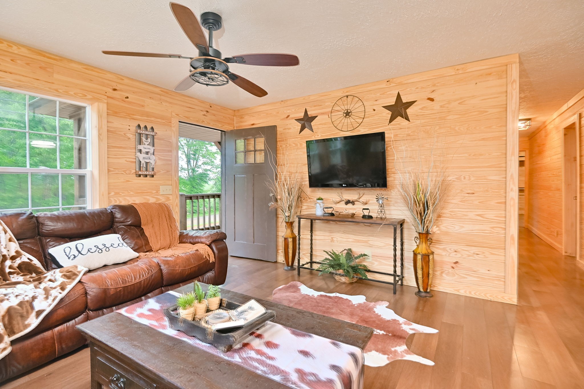 292 Harmony Road Gainesboro, TN 38562 - Photo 22 of 61 a living room with furniture a fireplace and a flat screen tv