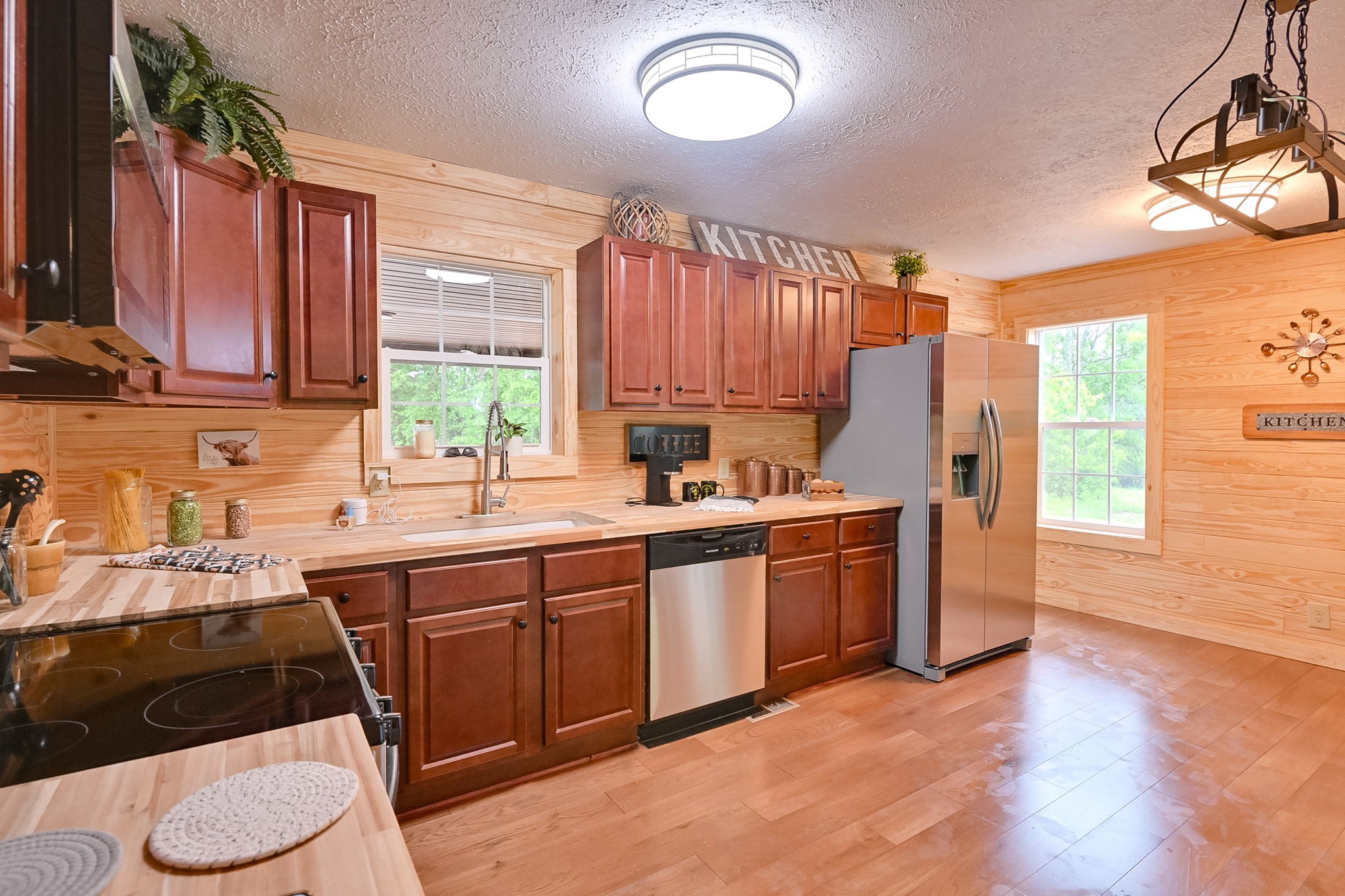 292 Harmony Road Gainesboro, TN 38562 - Photo 30 of 61 a kitchen with a sink stove and cabinets
