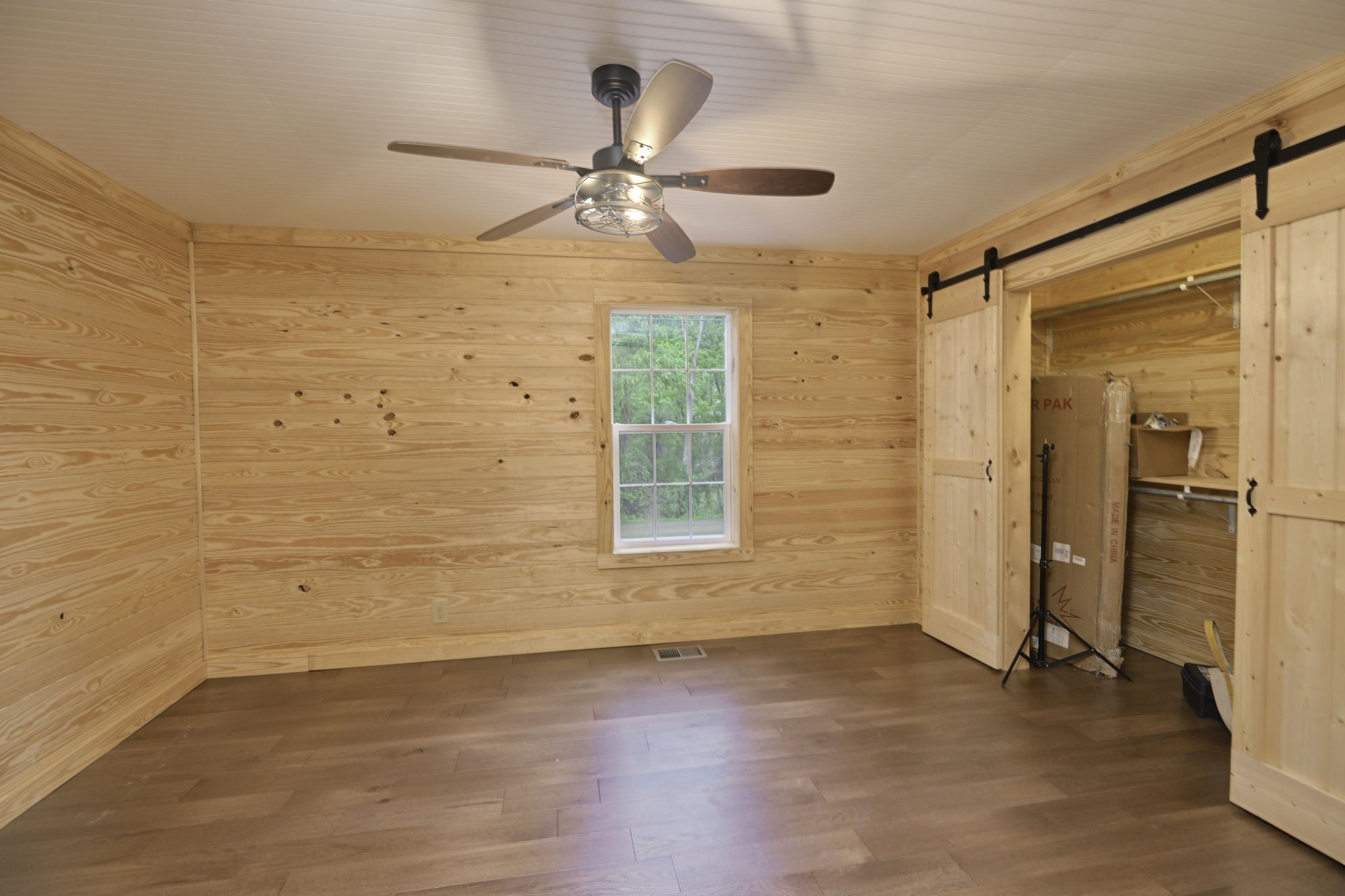 292 Harmony Road Gainesboro, TN 38562 - Photo 42 of 61 wooden floor in an empty room with a window