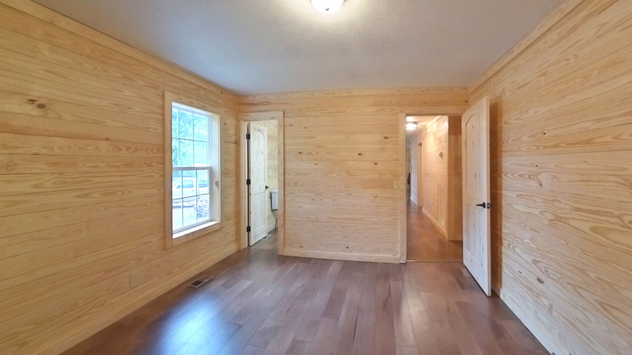 292 Harmony Road Gainesboro, TN 38562 - Photo 53 of 61 a view of an empty room with wooden floor and a window