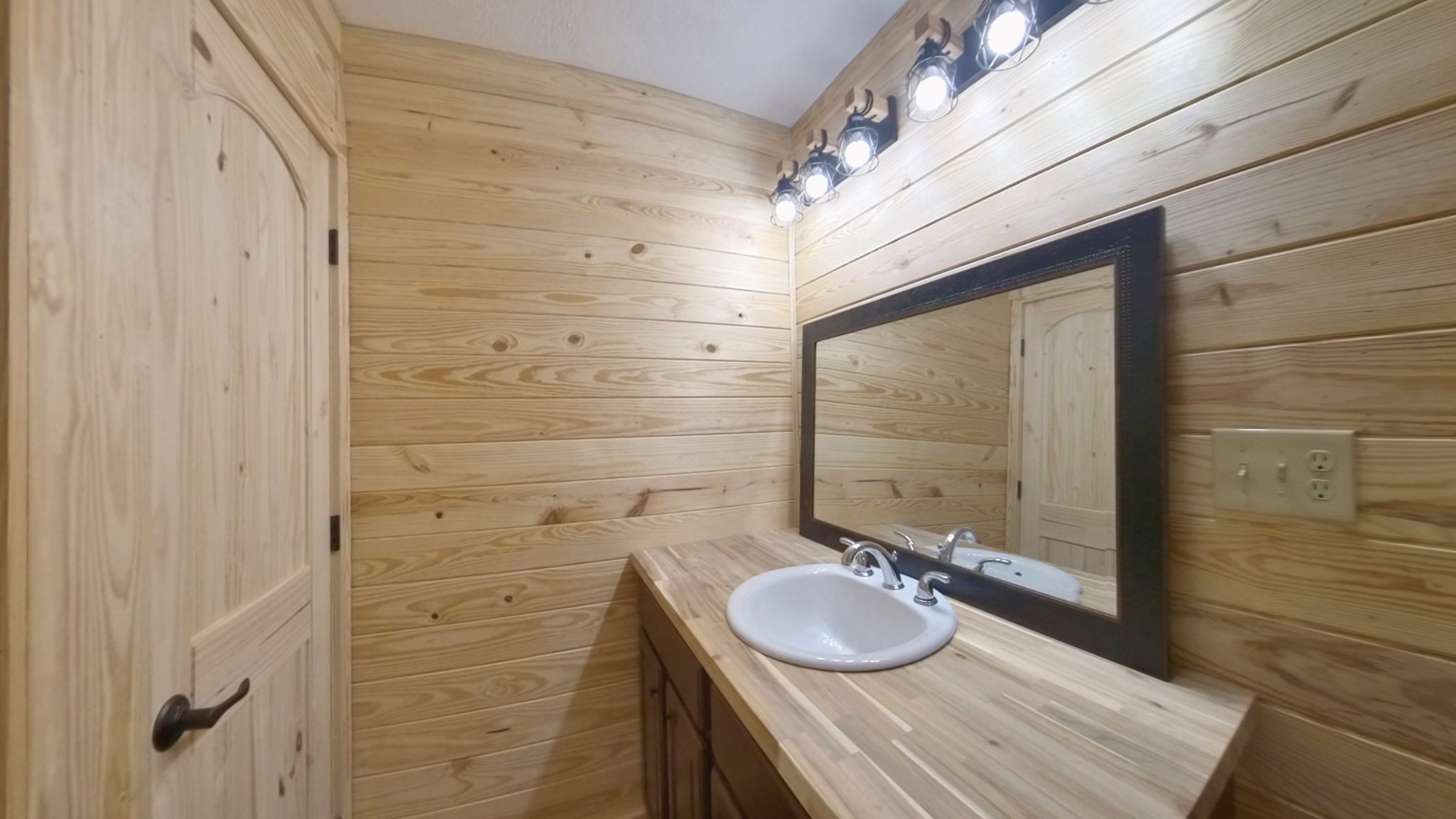 292 Harmony Road Gainesboro, TN 38562 - Photo 57 of 61 a bathroom with a granite countertop shower a sink and a mirror