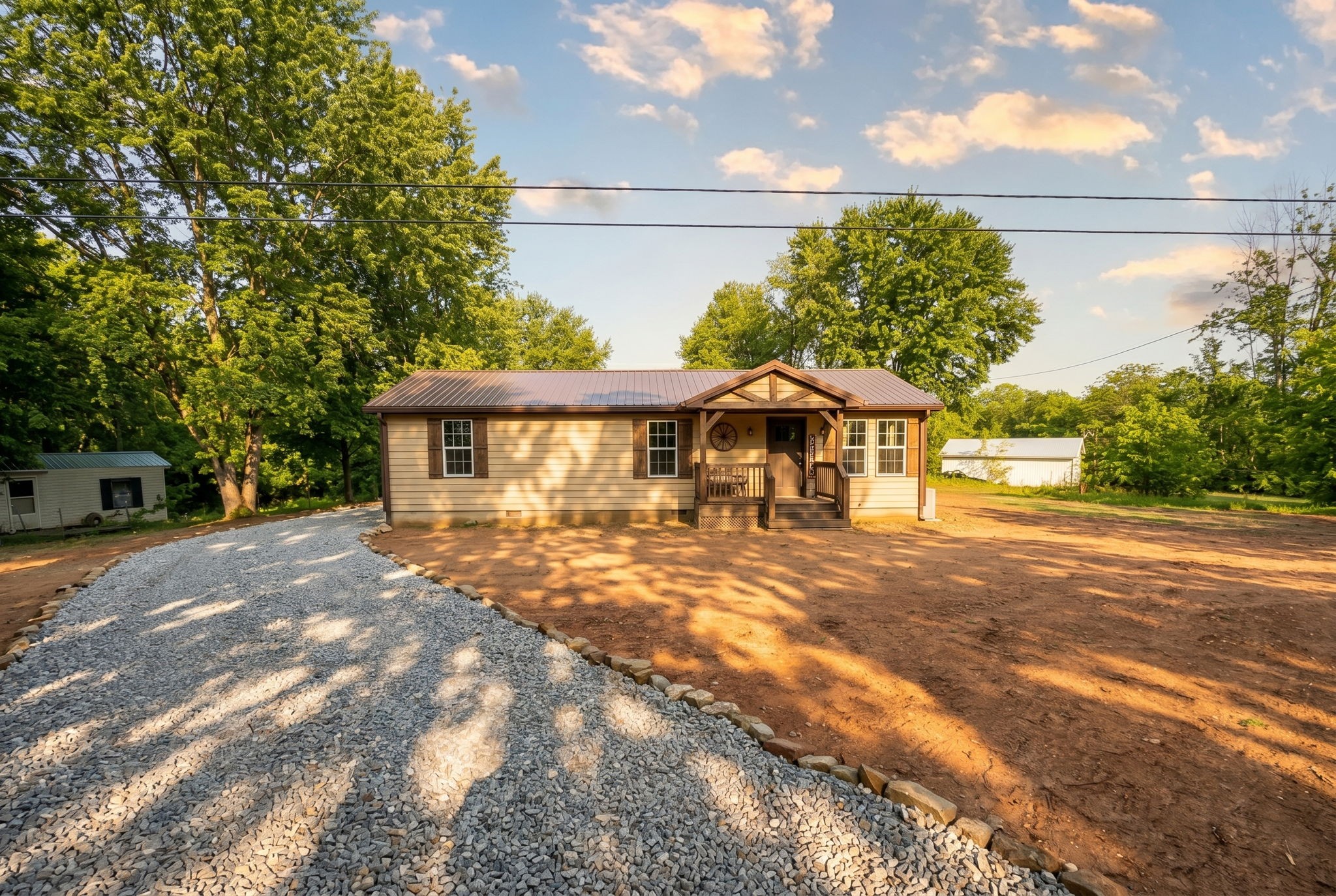 292 Harmony Road Gainesboro, TN 38562 - Photo 60 of 61 a front view of a house with a yard and potted plants