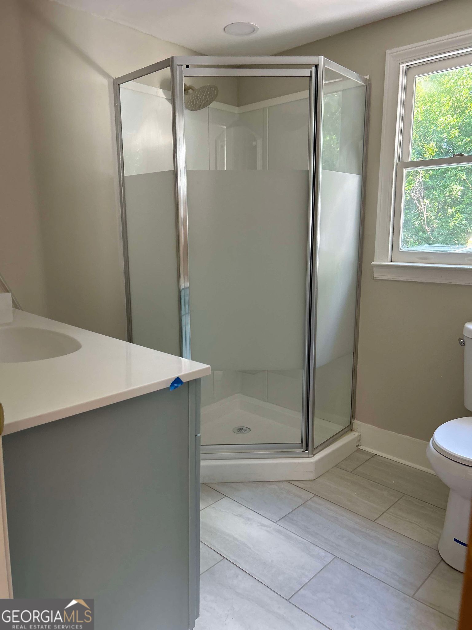 1428 2nd Street Macon, GA 31201 - Photo 6 of 10 a bathroom with a shower and a toilet