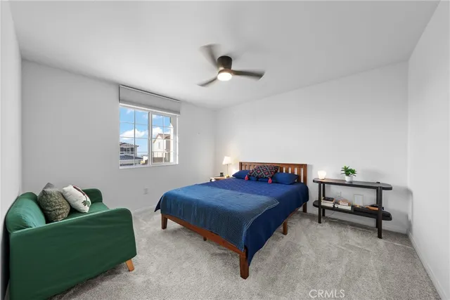 a bedroom with a bed and a couch