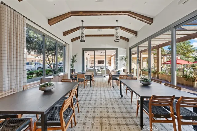 an outdoor sitting area with furniture