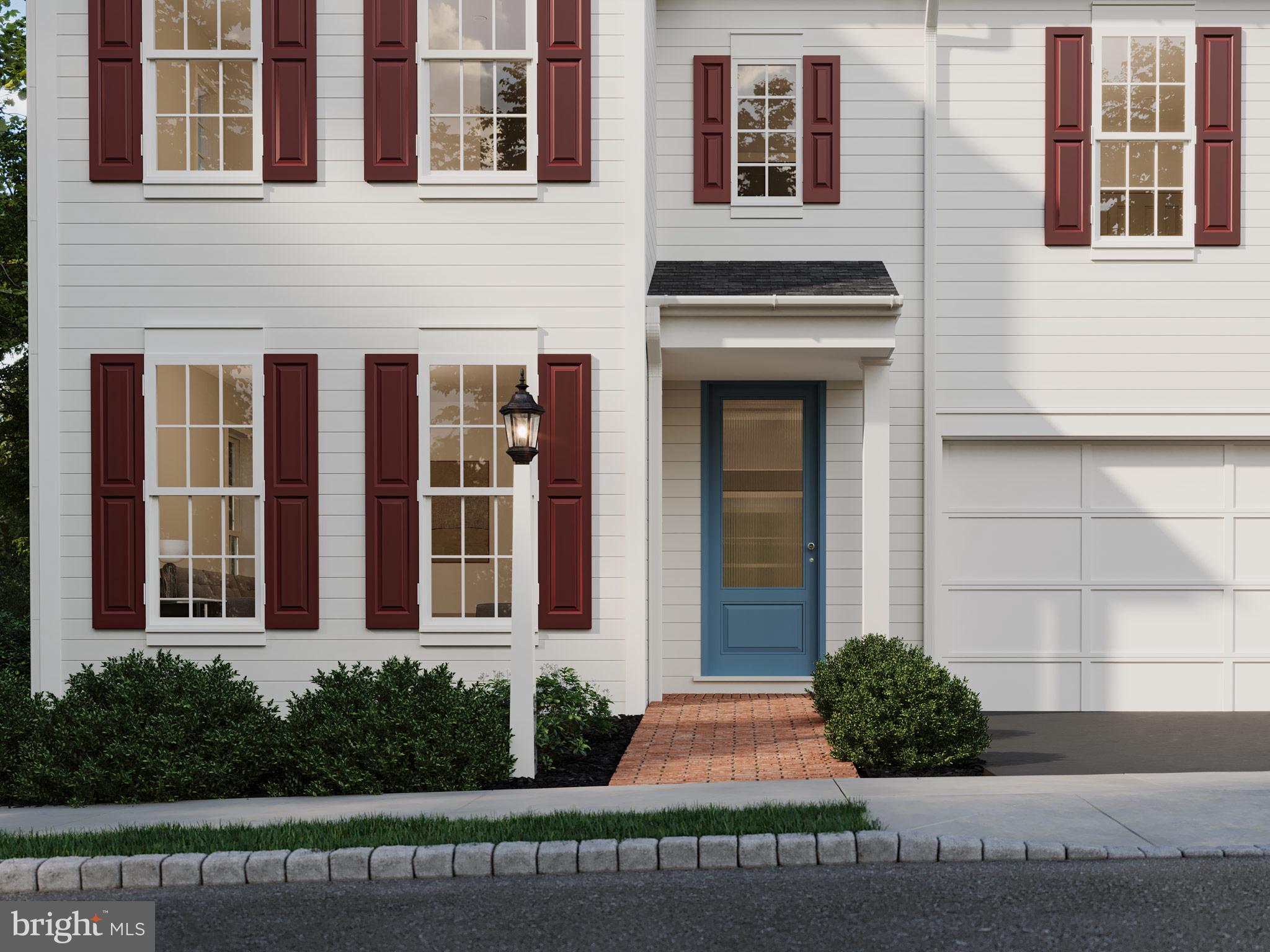 104 Merchant Avenue, Unit DUNDEE Mount Joy, PA 17552 - Photo 2 of 40 a front view of a house with a yard