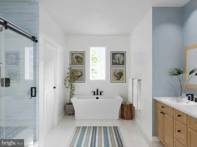 a en suite spacious bathroom with a double vanity sink a mirror and shower