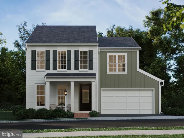 a view of a white house with large windows and a yard with plants and large trees