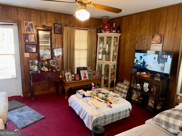 a bed room with furniture and a window