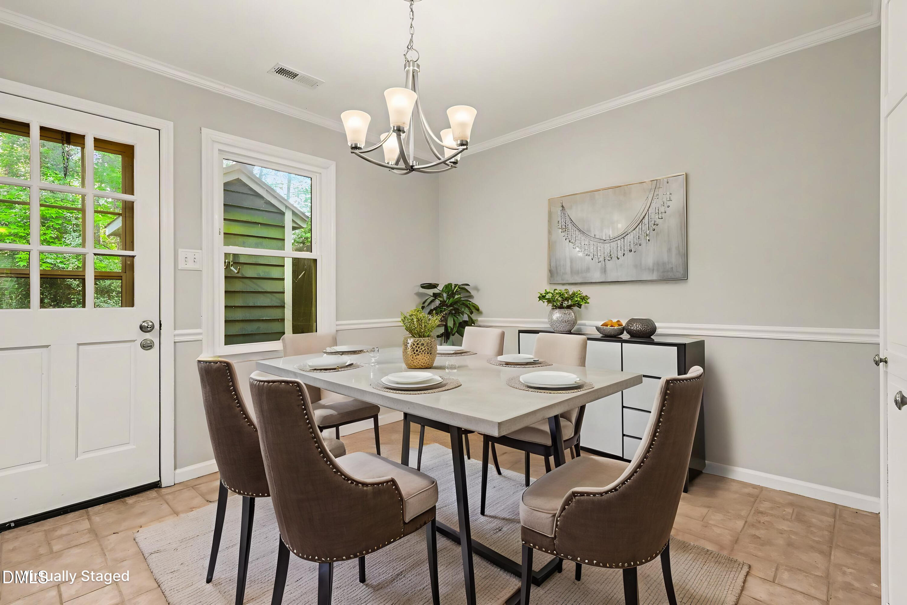 5645 Hamstead Crossing Raleigh, NC 27612 - Photo 4 of 35 a view of a dining room with furniture window and outside view