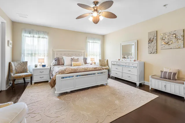 a spacious bedroom with a bed and a couch