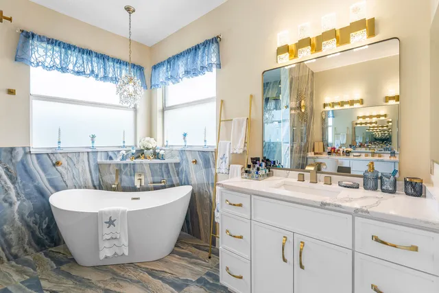 a room with a large window and a sink