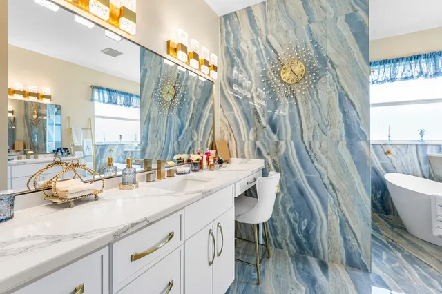 a bathroom with a sink mirror and a bathtub