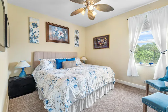 a bedroom with bed and a window