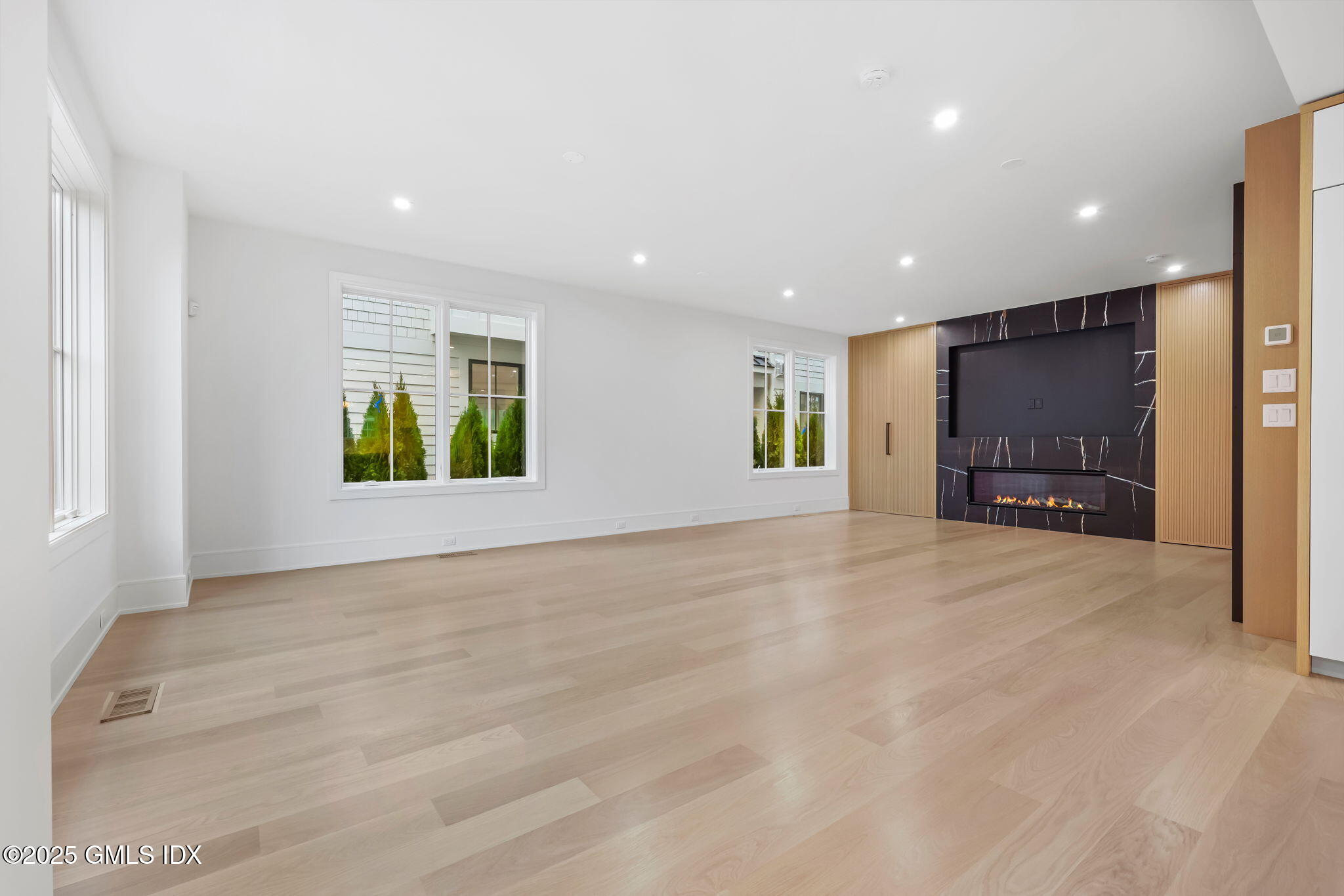 191 Field Point Road, Unit A Greenwich, CT 06830 - Photo 4 of 29 Family room looking at fireplace