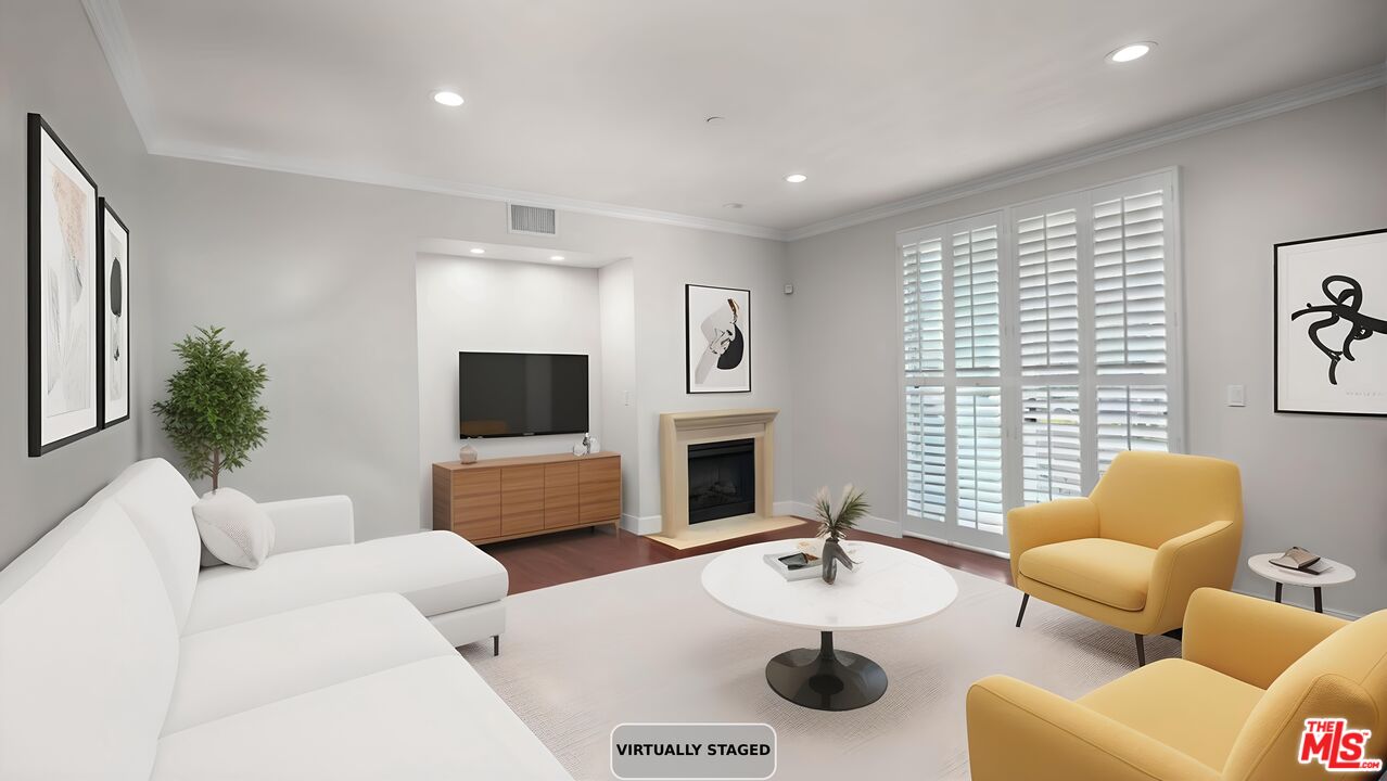2240 South Beverly Glen Boulevard, Unit 103 Los Angeles, CA 90064 - Photo 1 of 27 a living room with furniture and a flat screen tv