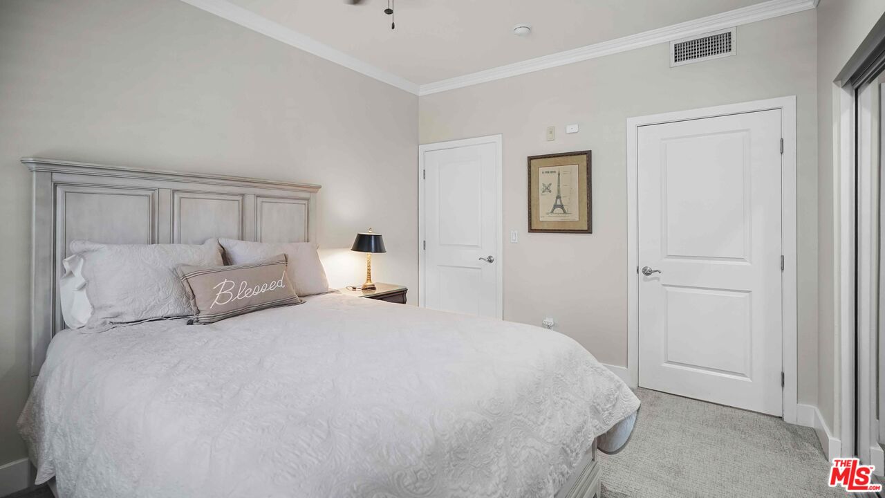 2240 South Beverly Glen Boulevard, Unit 103 Los Angeles, CA 90064 - Photo 17 of 27 a large white bed in a white room