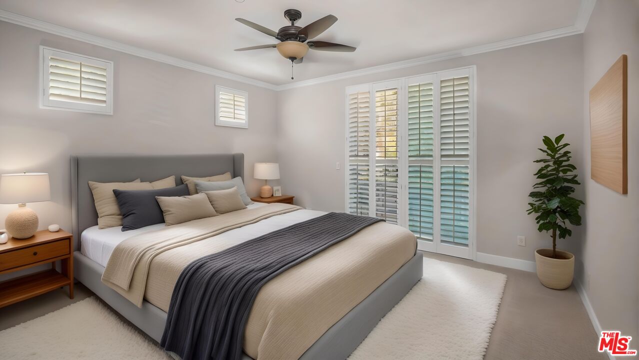 2240 South Beverly Glen Boulevard, Unit 103 Los Angeles, CA 90064 - Photo 3 of 27 a bedroom with a large bed and a potted plant