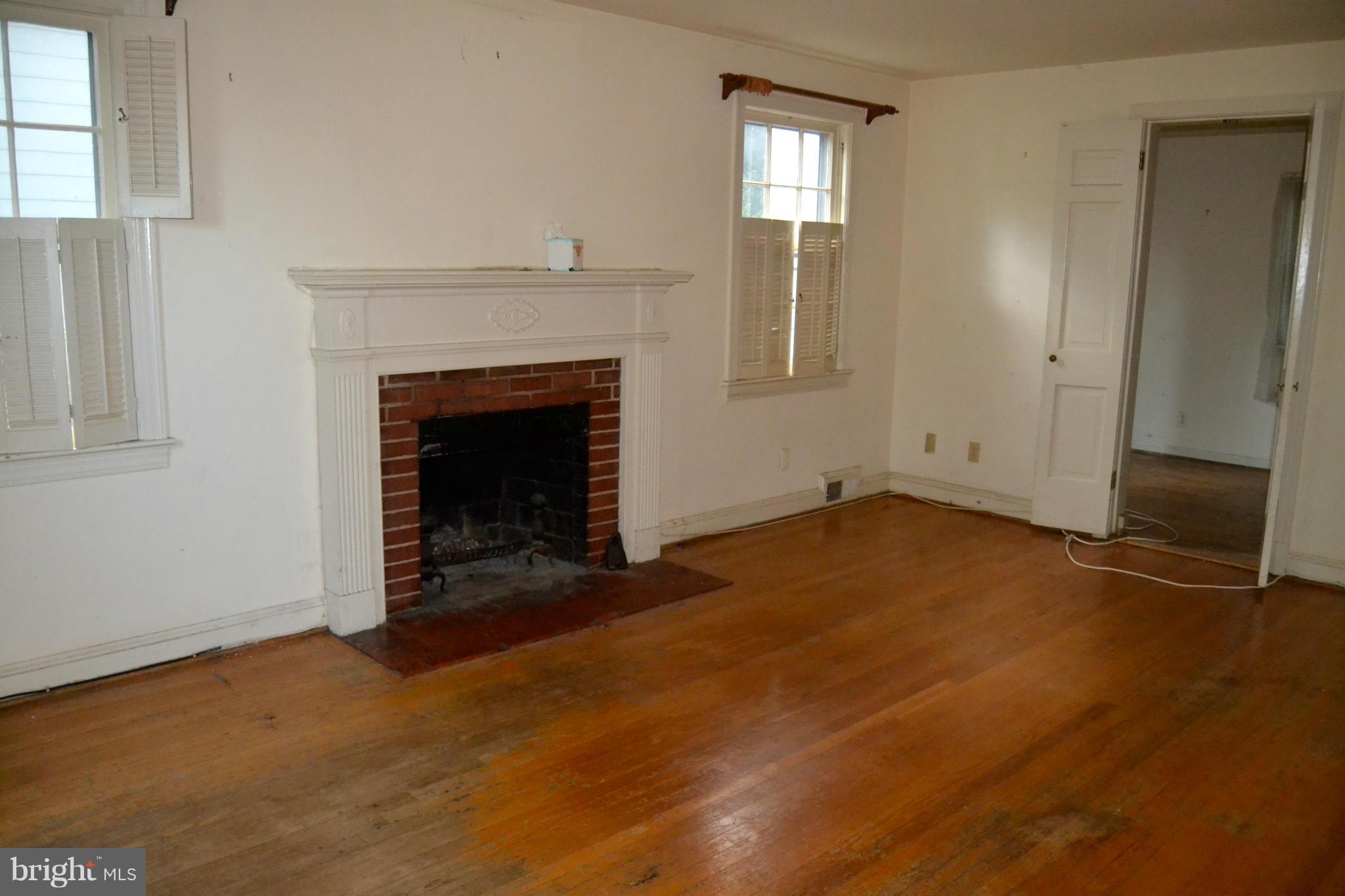 6919 Fairfax Road Bethesda, MD 20814 - Photo 2 of 17 Living Room with hardwood floor and fireplace