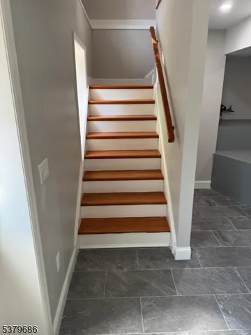 a kitchen with stainless steel appliances granite countertop a stove and a wooden floors
