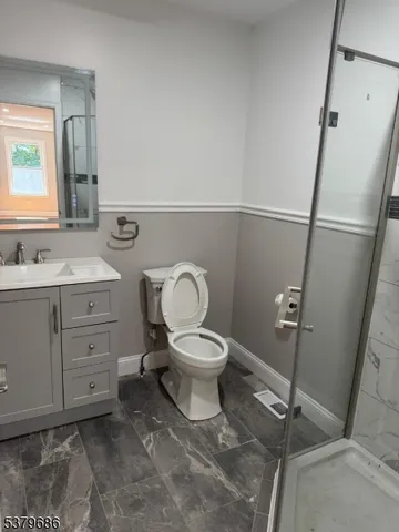 a bathroom with a toilet and a tub