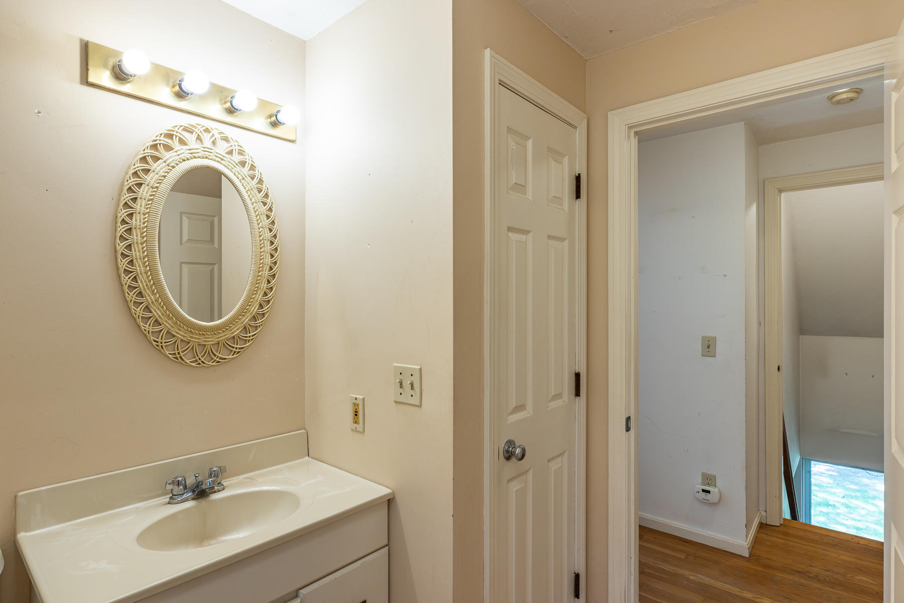 54 Crawford Road Cotuit, MA 02635 - Photo 26 of 46 a bathroom with a sink and a mirror