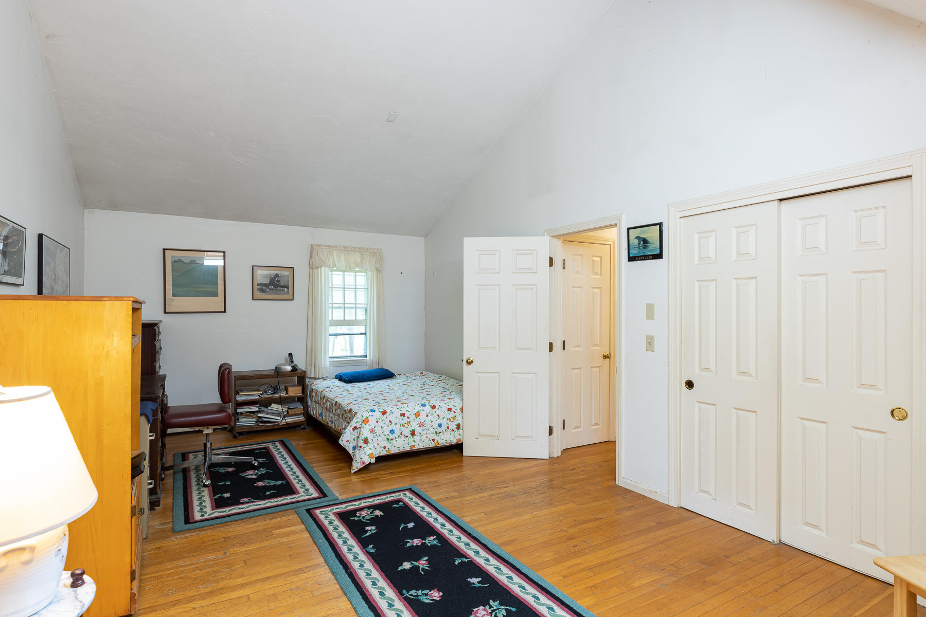 54 Crawford Road Cotuit, MA 02635 - Photo 27 of 46 a bedroom with bed and wooden floor