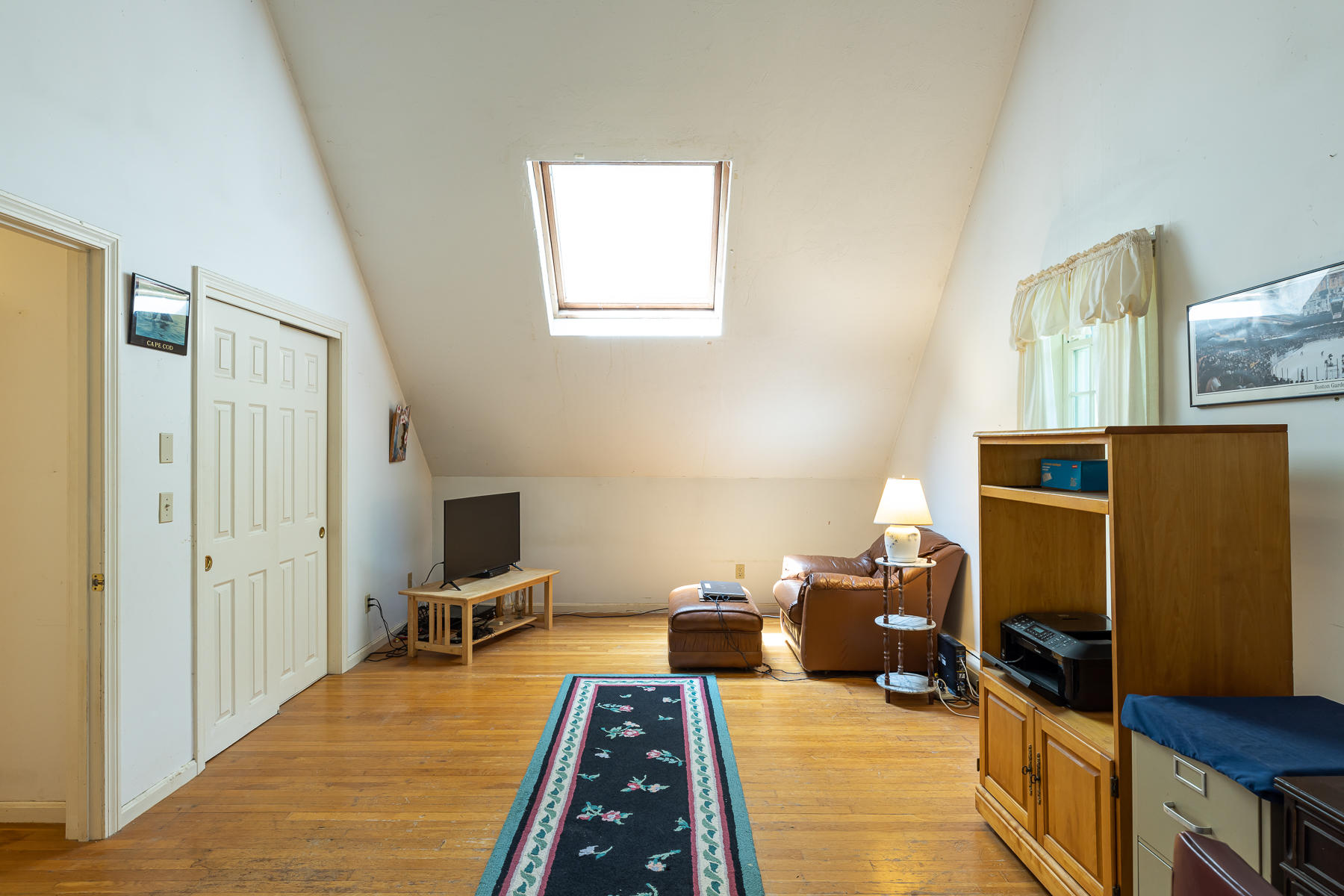 54 Crawford Road Cotuit, MA 02635 - Photo 29 of 46 a bed room with a bed and a television