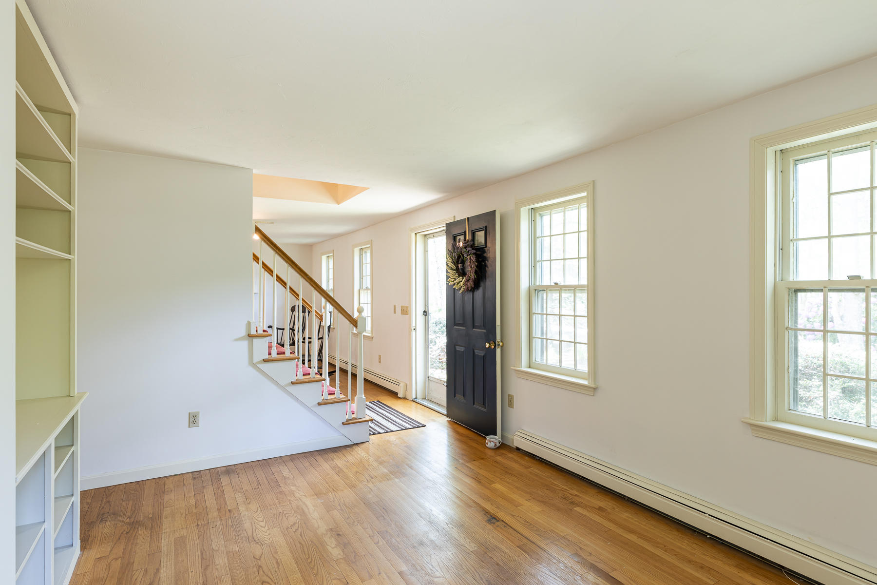 54 Crawford Road Cotuit, MA 02635 - Photo 3 of 46 a view of an entryway with wooden floor and windows