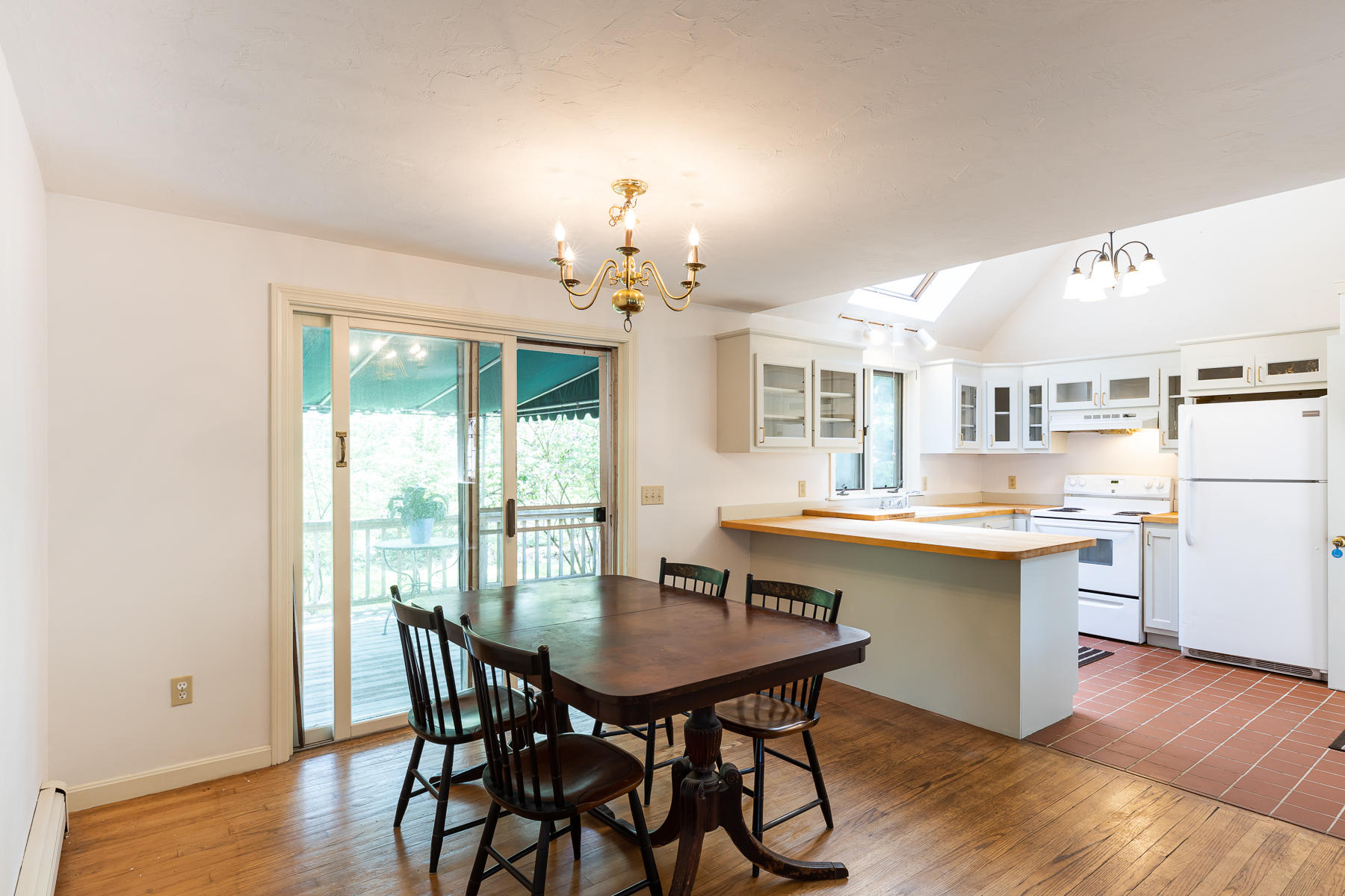 54 Crawford Road Cotuit, MA 02635 - Photo 7 of 46 a view of a dining room with furniture and wooden floor