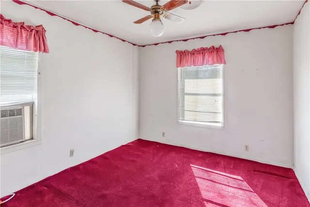 a view of a bathroom from a hallway