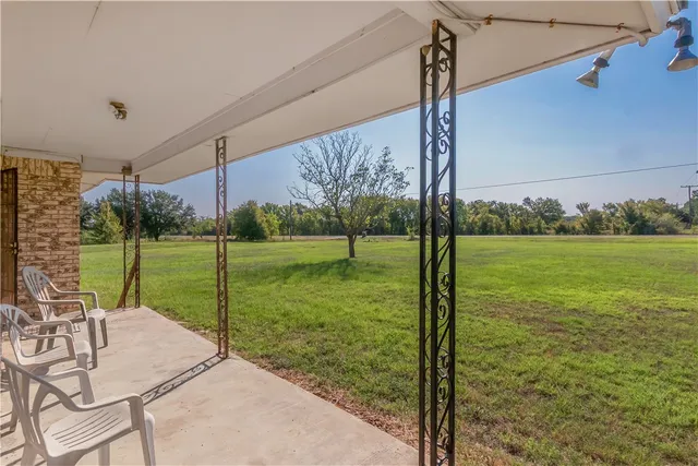 a view of a garden with a table