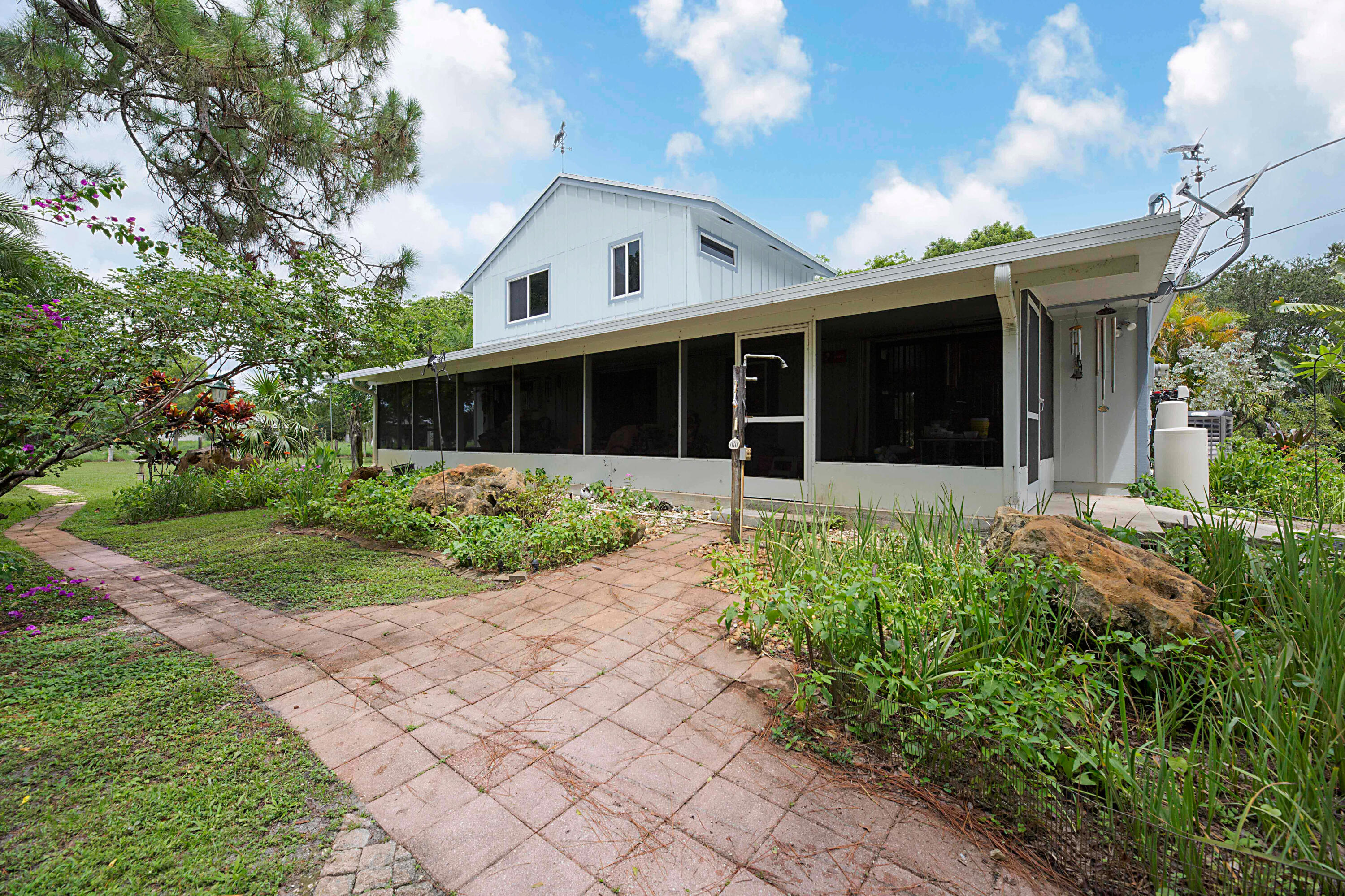 4852 Windmill Road Loxahatchee, FL 33470 - Photo 21 of 36 Screened back porch