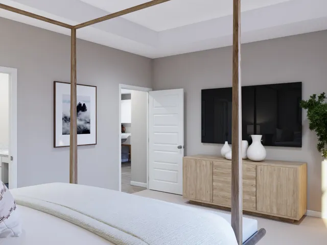 a bedroom with a bed and flat screen tv