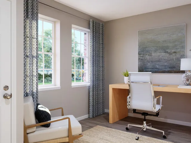 a bedroom with a bed window and a table