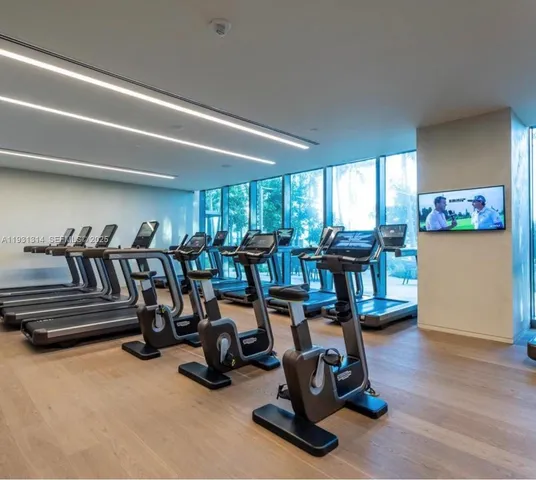 a view of a balcony with a glass door