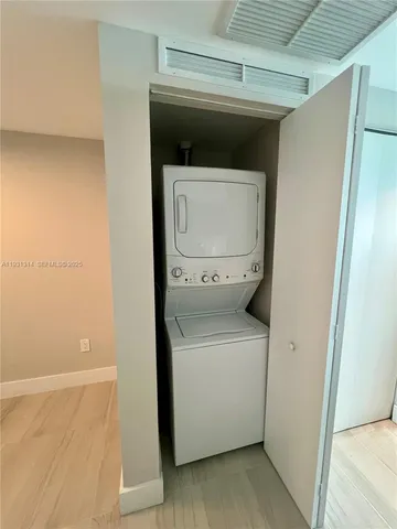 a bedroom with a large bed and a couch