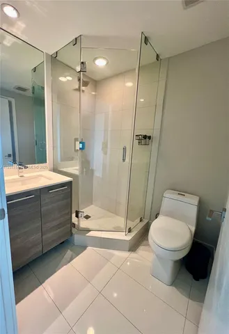 a room with walk in closet and window