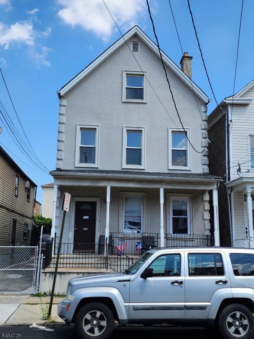 a front view of a house with parking space