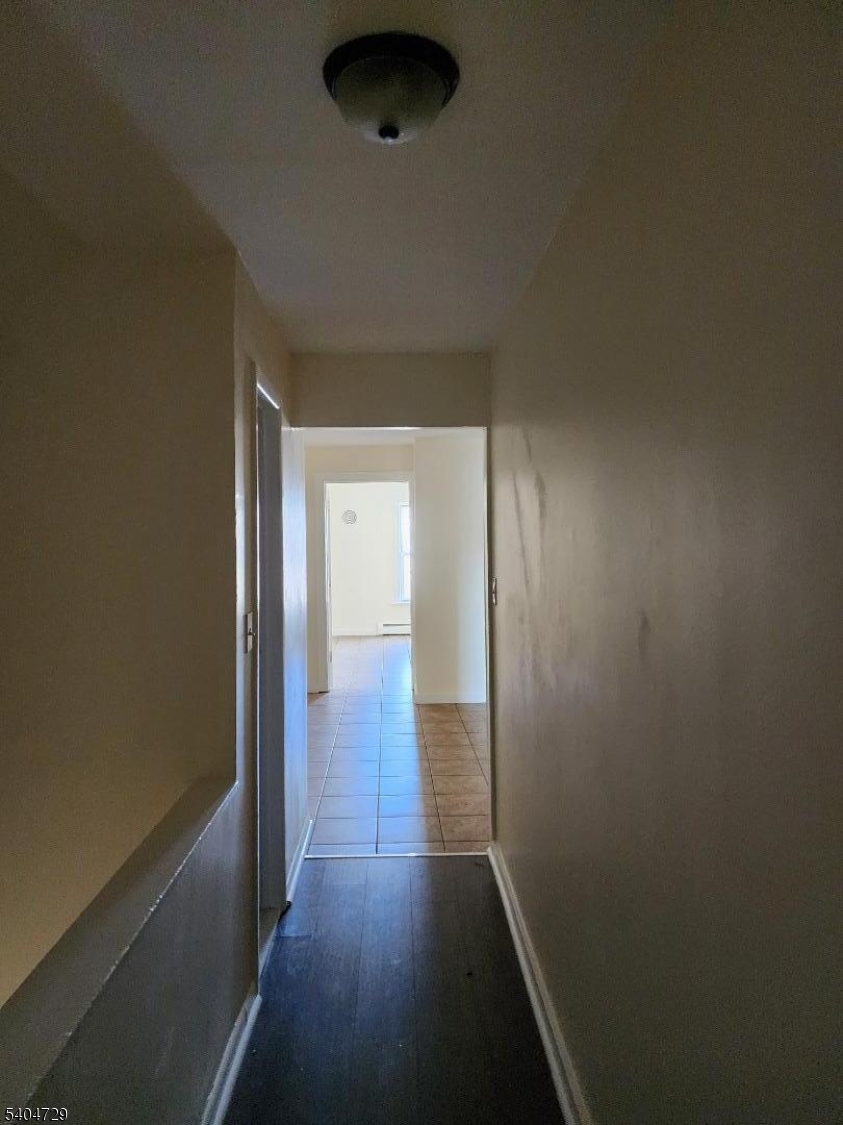 239 Magnolia Avenue Elizabeth Port, NJ 07206 - Photo 4 of 11 a view of a room with wooden floor