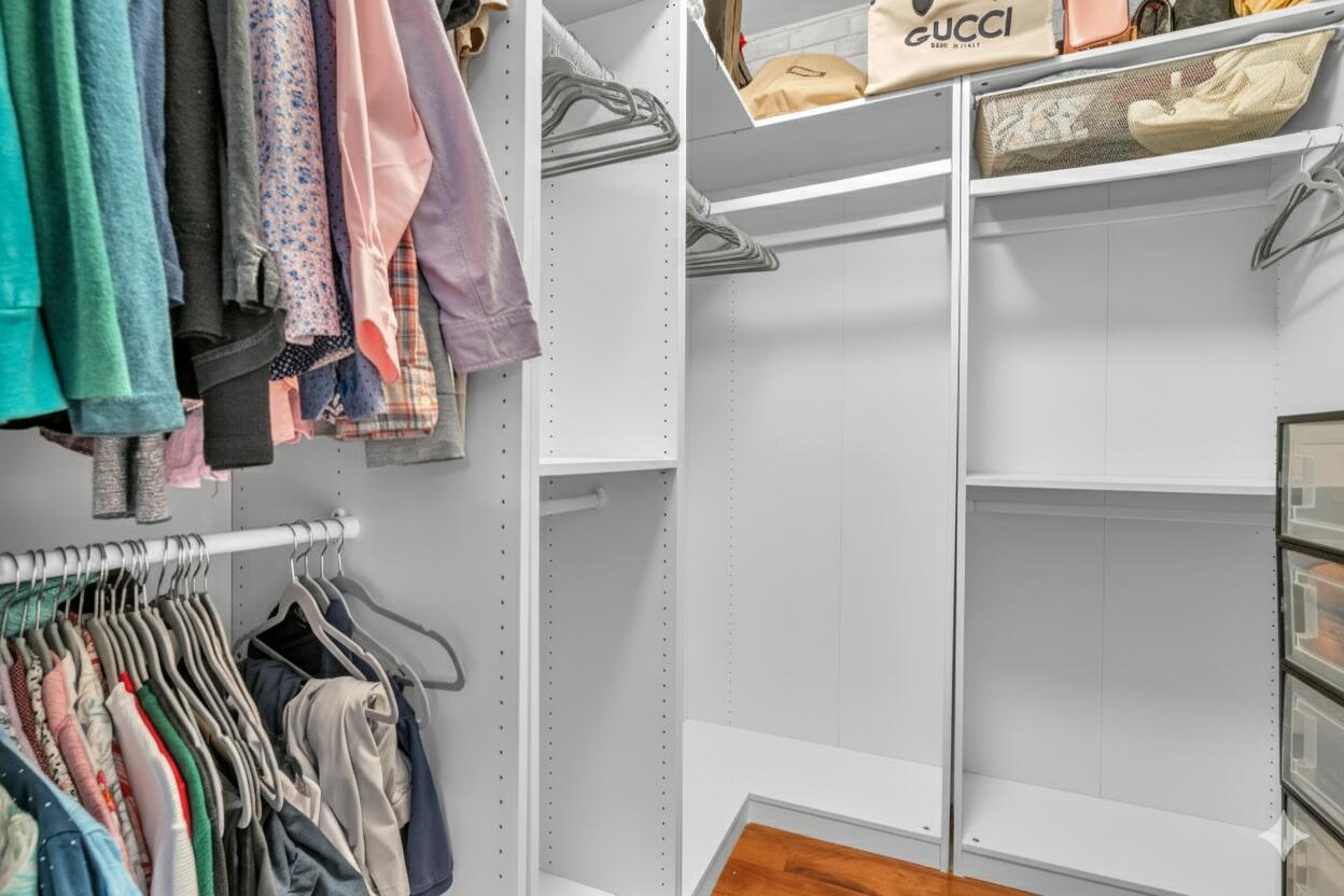 5157 Floria Way, Unit T Boynton Beach, FL 33437 - Photo 13 of 40 a view of walk in closet with clothes and shoes