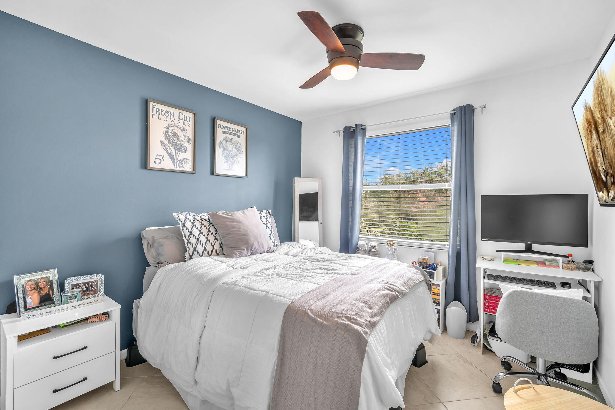 5157 Floria Way, Unit T Boynton Beach, FL 33437 - Photo 16 of 40 a bedroom with a bed and a flat screen tv