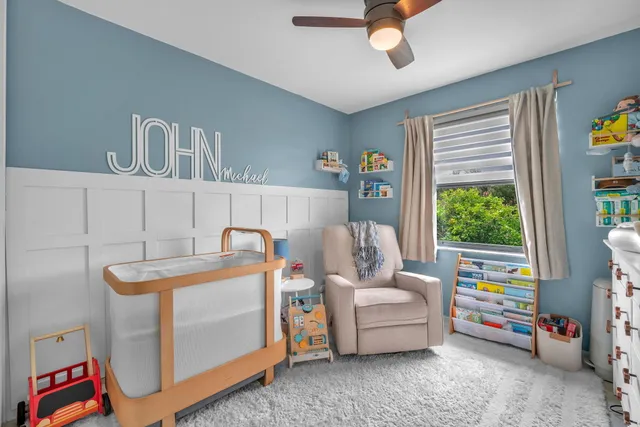 a bedroom with furniture and a window