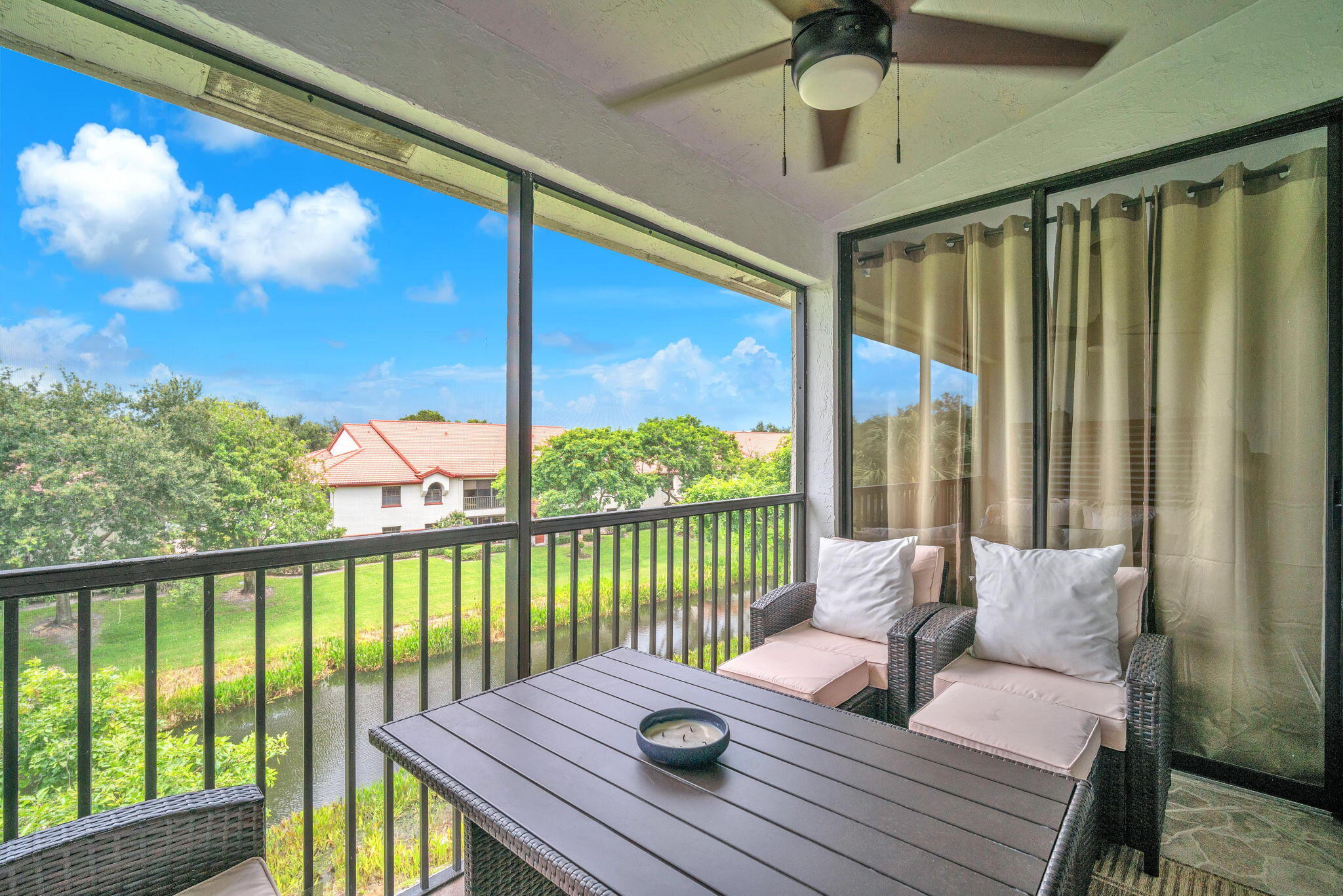 5157 Floria Way, Unit T Boynton Beach, FL 33437 - Photo 20 of 40 a view of a balcony with chair and wooden floor