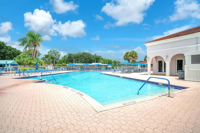 a view of a swimming pool with a lounge chairs