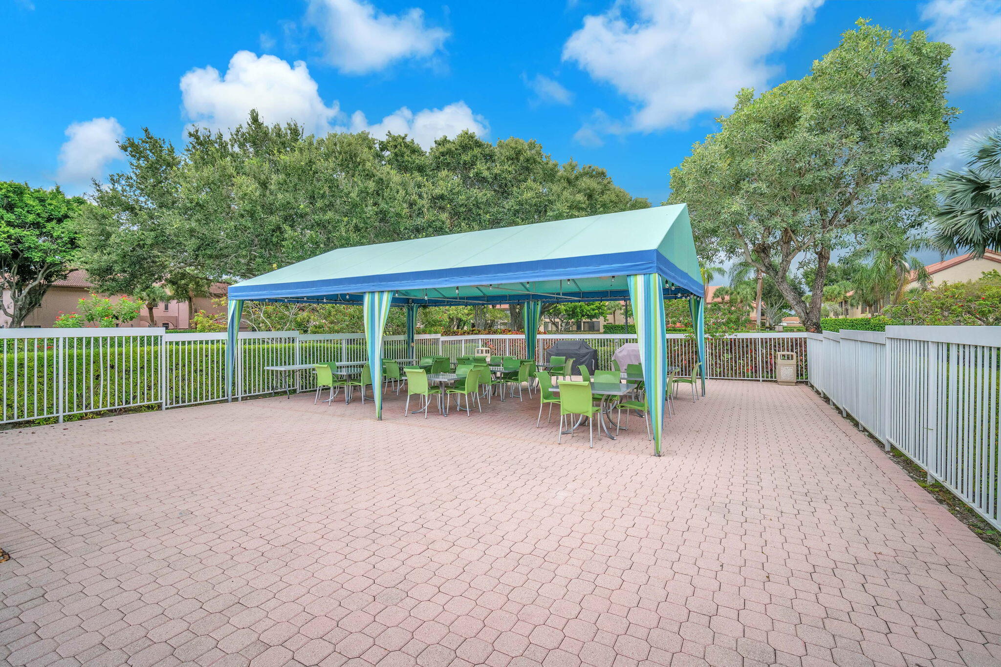 5157 Floria Way, Unit T Boynton Beach, FL 33437 - Photo 29 of 40 a view of a house with backyard and a porch